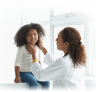 Doctor assisting little girl